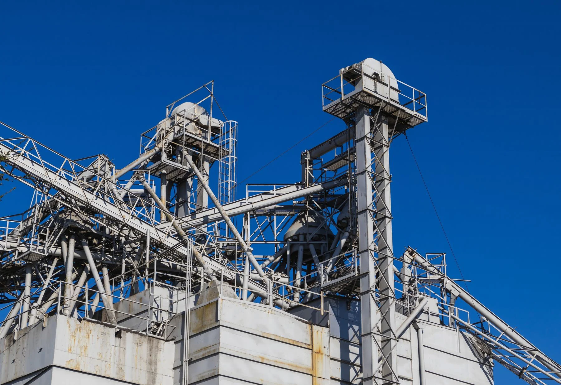 Industrial structures with pipes and access platforms