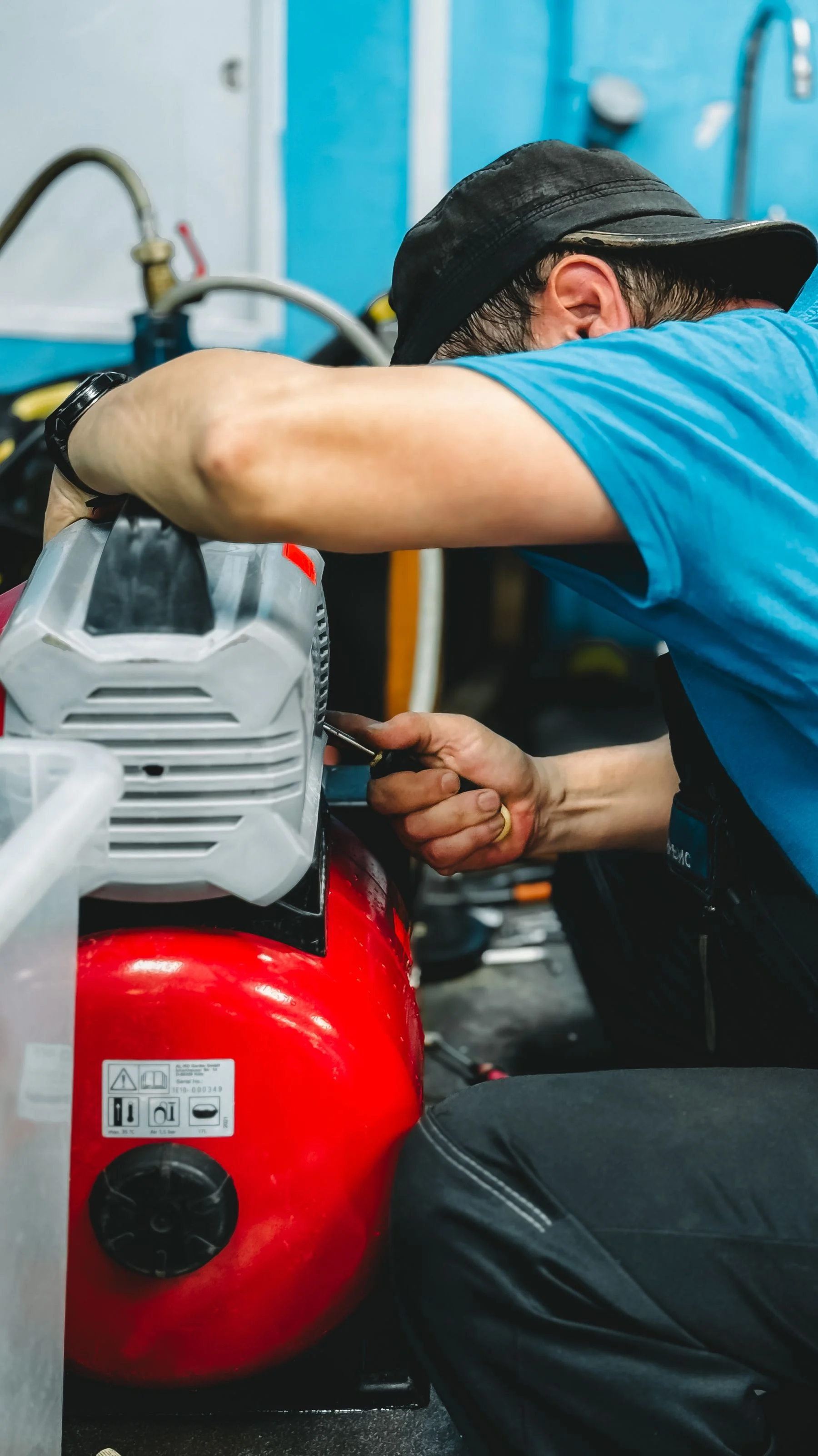 Technician working on an air compressor