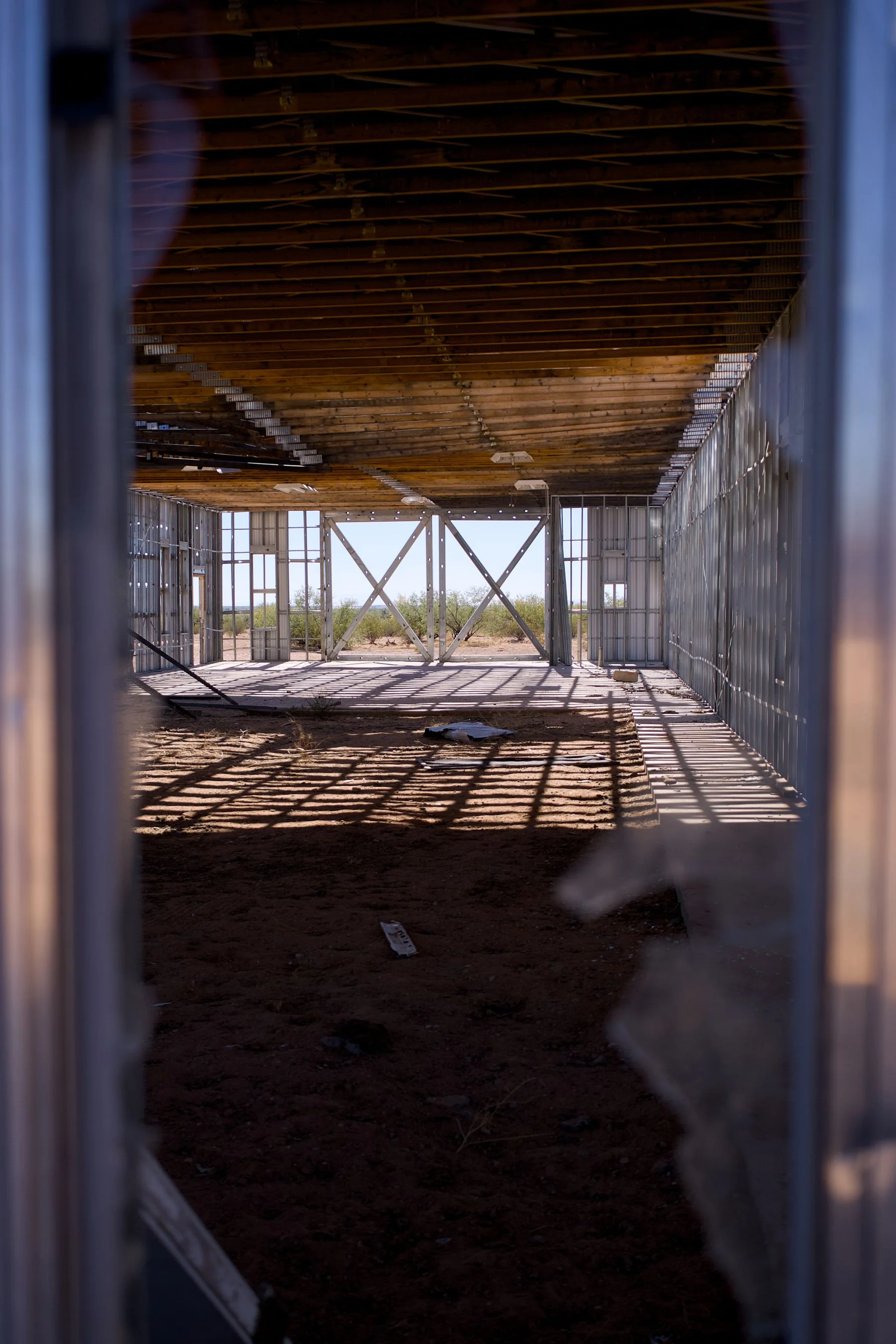 Partially constructed building interior with beams and open space