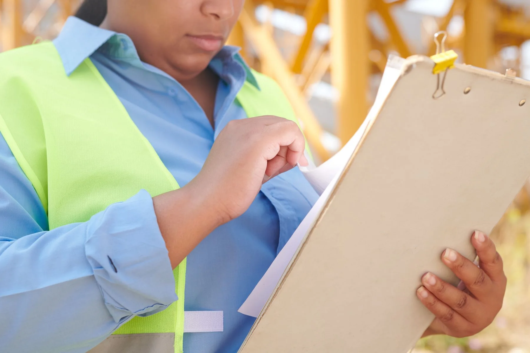 Site requirements reviewed on a clipboard