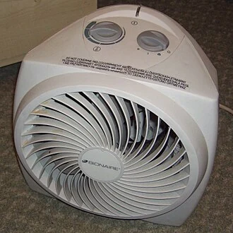 Compact fan heater with temperature and fan controls