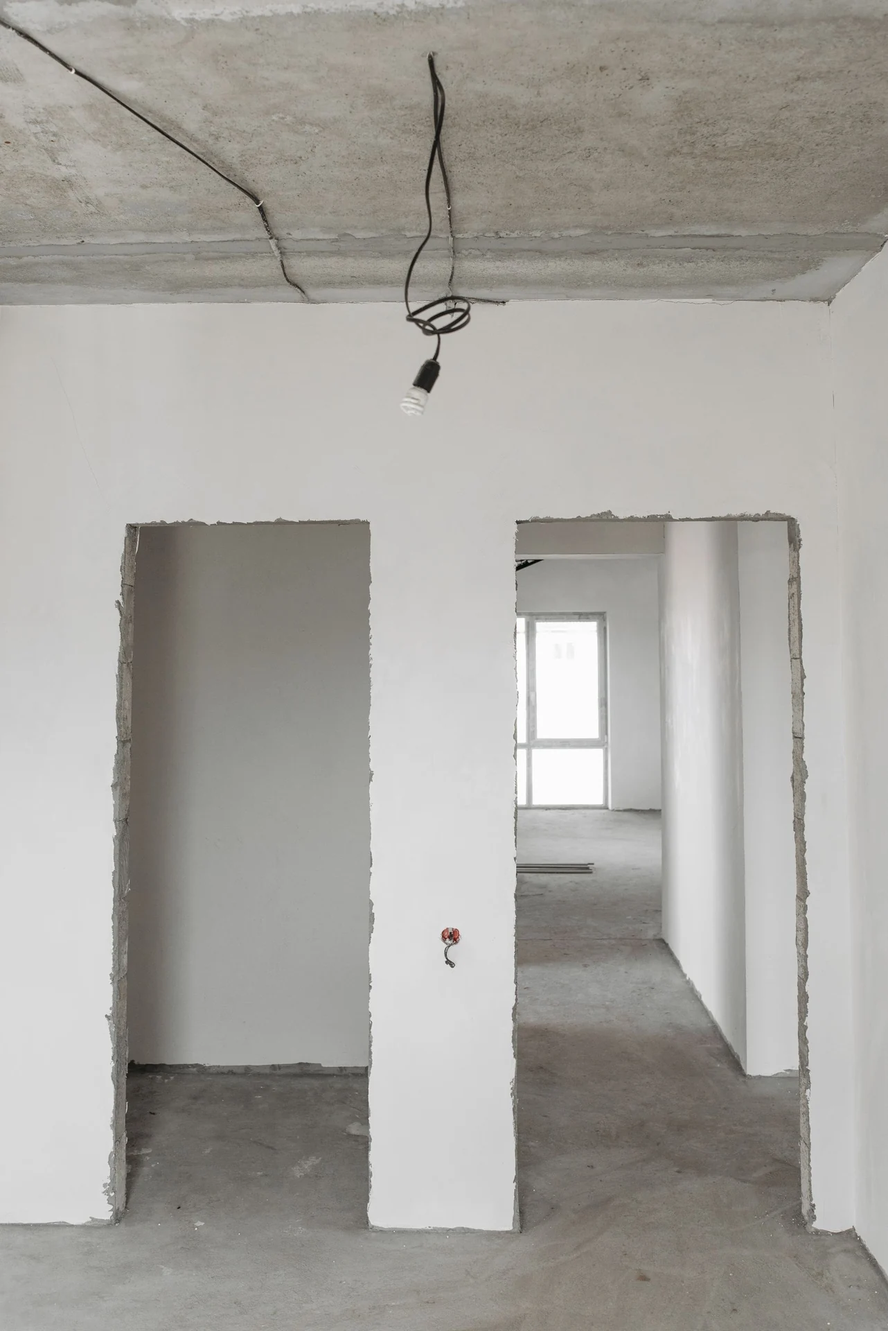 Enclosed work area with unfinished walls and an exposed ceiling